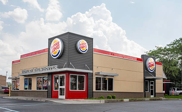 Dayton, Ohio, USA - May 29, 2016: The newest Burger King 20/20 restaurant design with a sleek, contemporary, futuristic industrial-look theme includes brick cladding, manicured landscaping and a covered drive-thru order point with digital order screens. The new design was first introduced in USA in April 1, 2010.